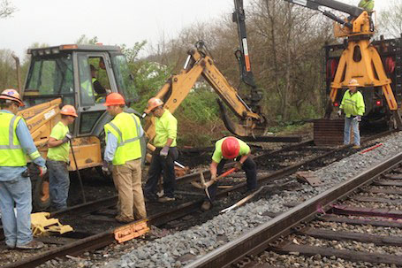 ROWC crew coordinating track work alongside excavators